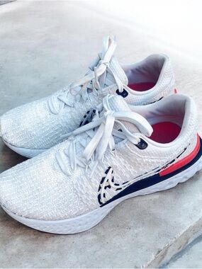 Nike Women's White Running Sneakers with Navy & Coral Accents